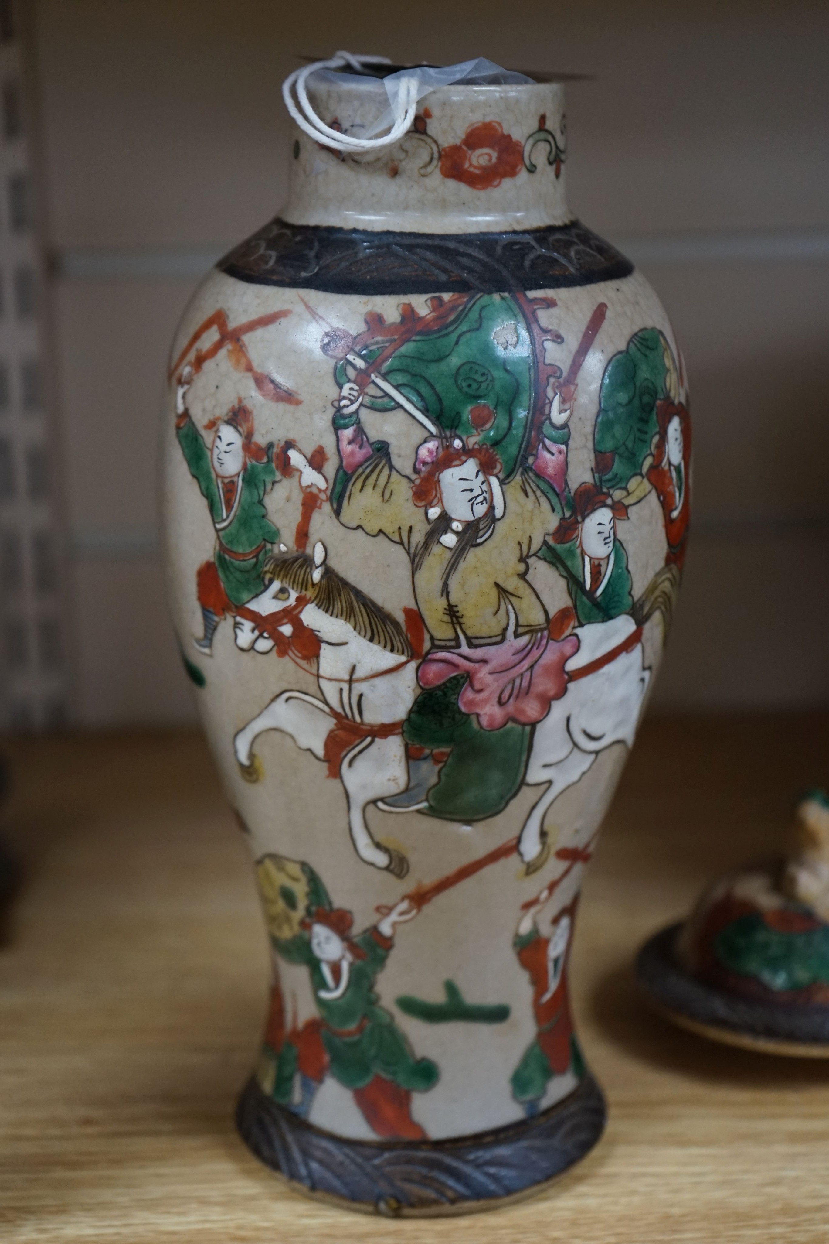 A late 19th century Chinese crackle glaze famille rose baluster vase and cover 30cm